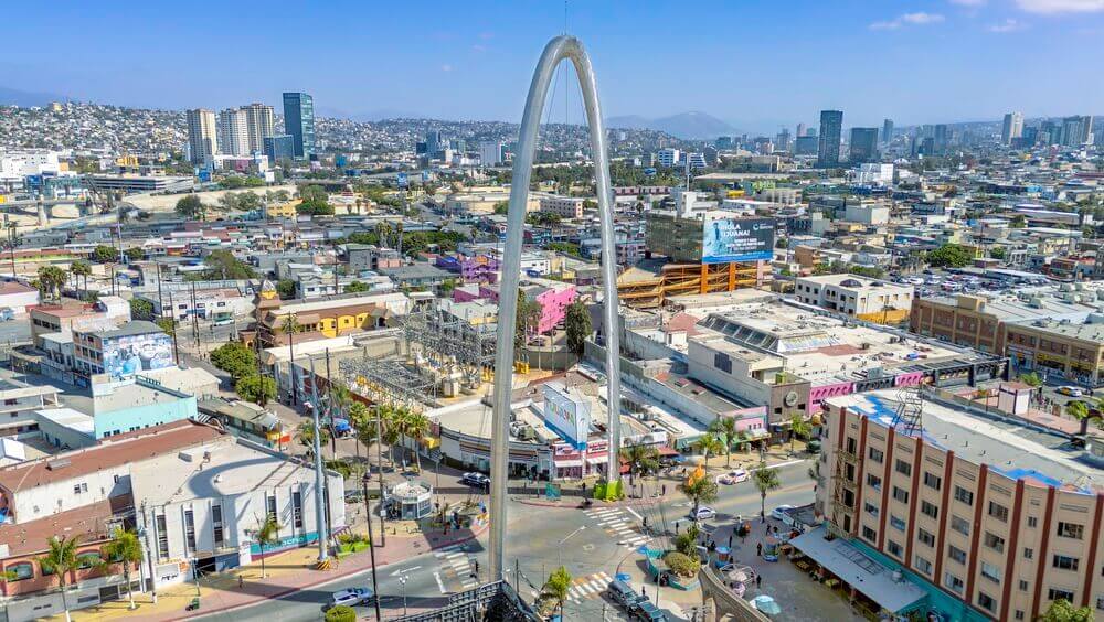View of downtown Tijuana and the iconic archway, highlighting the urban environment for people relocating to Tijuana.